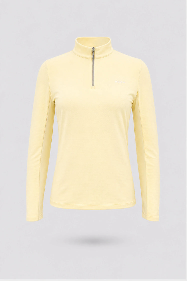 Women’s yellow long sleeve zip-neck golf top with breathable stretch fabric and UV protection front view