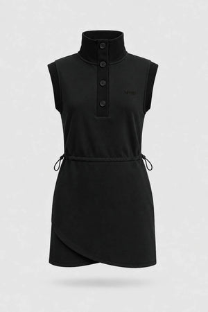 Front view of women's black sleeveless golf dress with buttoned stand collar, drawcord waist and asymmetric wrap hem