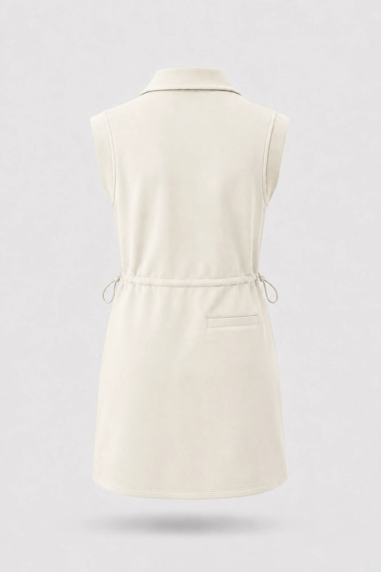 Back view of women's ivory sleeveless golf dress with folded collar, adjustable drawcord waist and back pocket