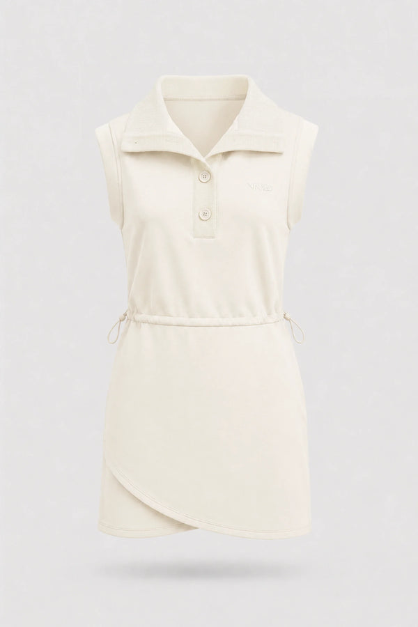 Front view of women's ivory sleeveless golf dress with folded collar, adjustable drawcord waist and asymmetric wrap hem