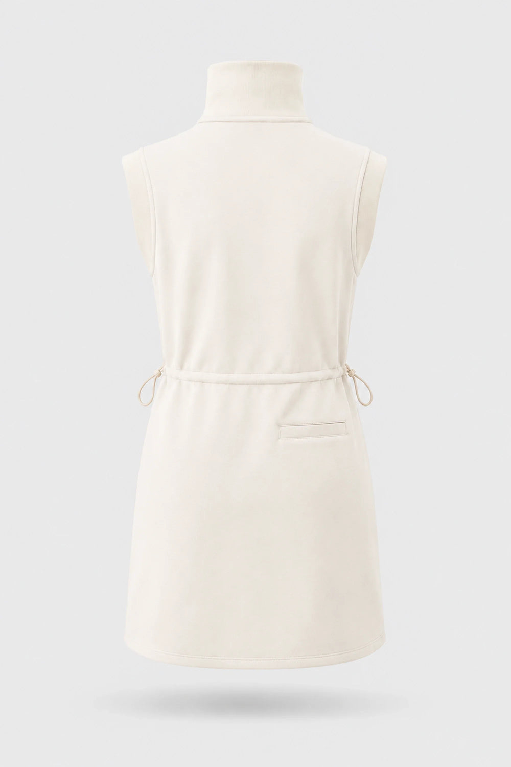 Front view of women's ivory sleeveless golf dress with buttoned stand collar, drawcord waist and asymmetric wrap hem