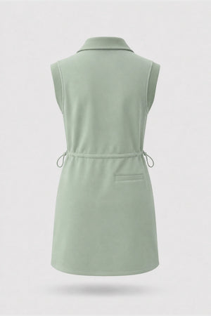 Back view of women's sage green sleeveless golf dress with folded collar and adjustable drawcord waist
