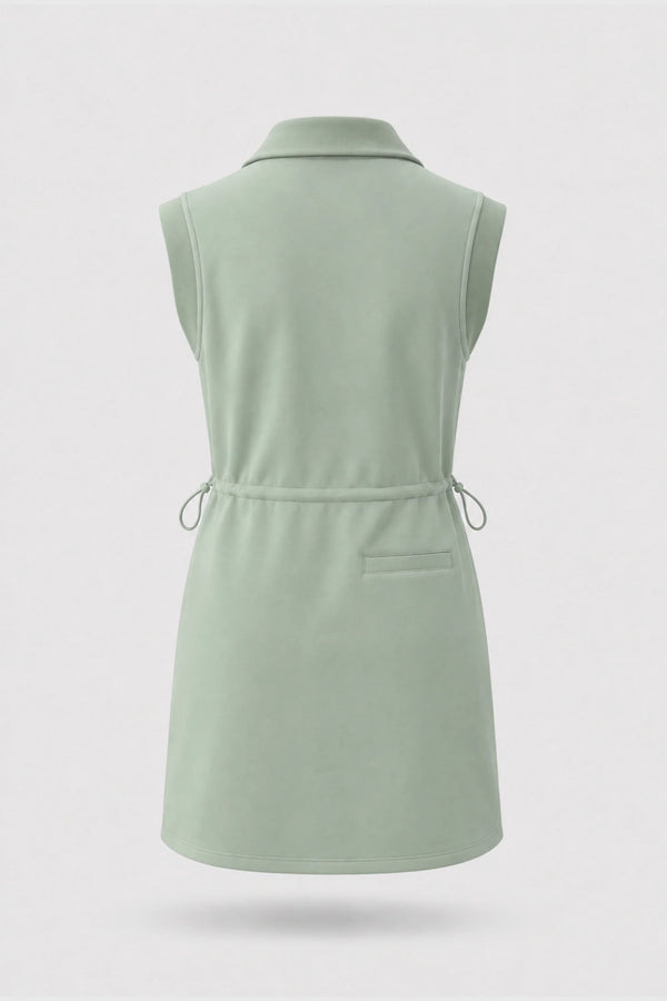 Back view of women's sage green sleeveless golf dress with folded collar and adjustable drawcord waist