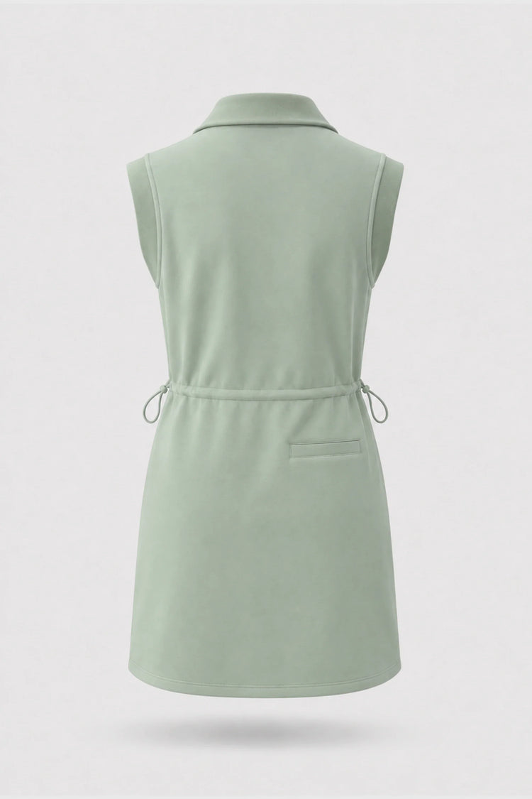 Back view of women's sage green sleeveless golf dress with folded collar and adjustable drawcord waist