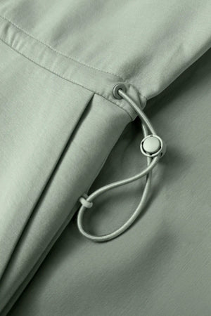 Close-up of the adjustable drawcord waist on the Sage Mist women’s sleeveless golf dress